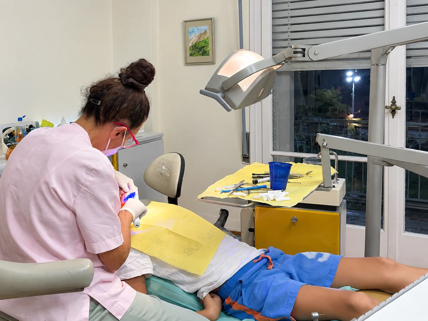 A clinician caring for a patient in the treatment room