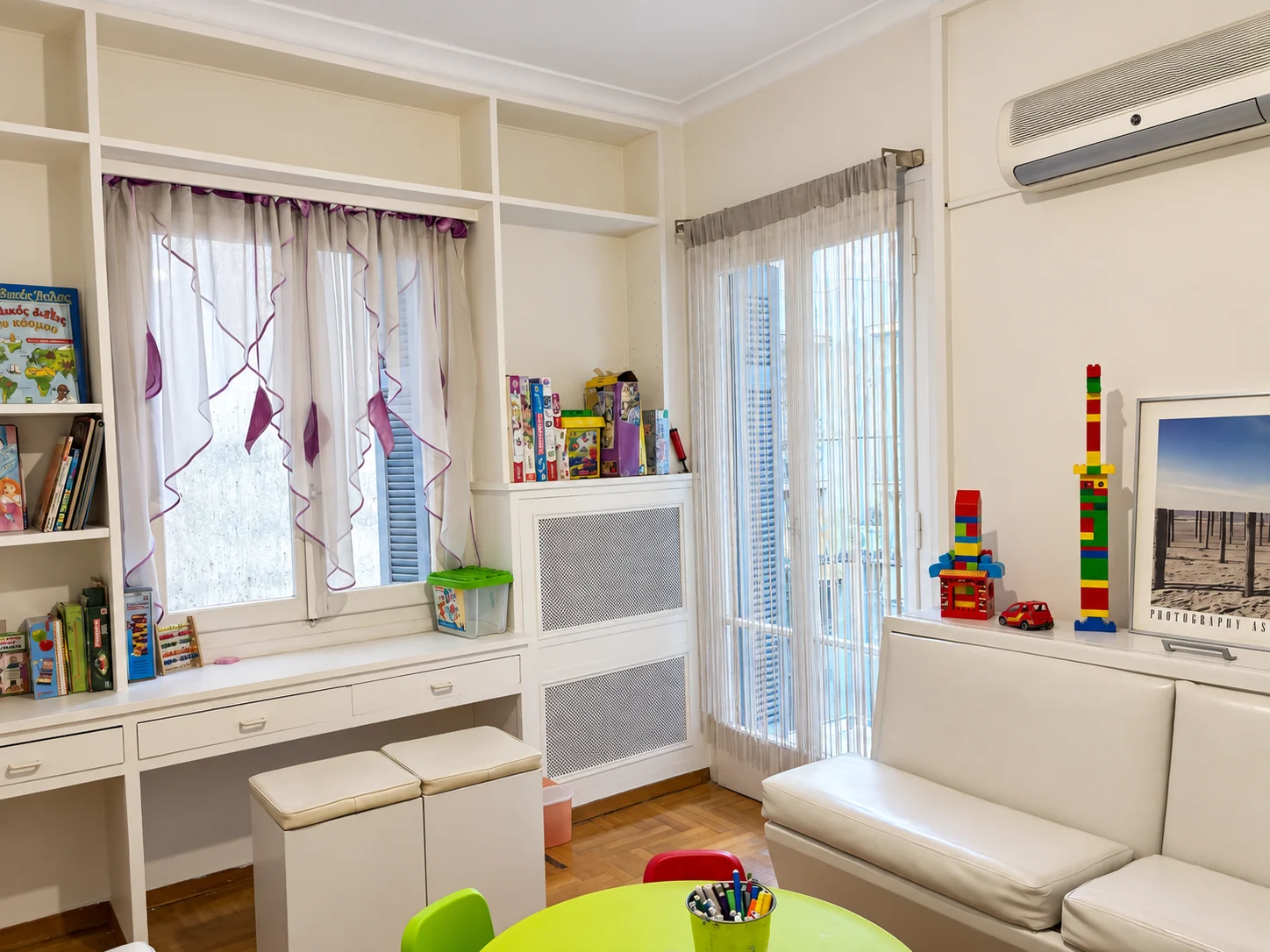 Bookshelves, building blocks and family seating in the children’s play area
