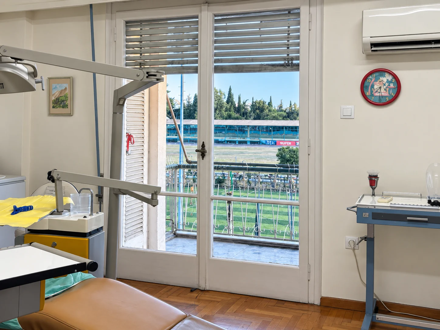 Treatment space with balcony doors overlooking the sports ground