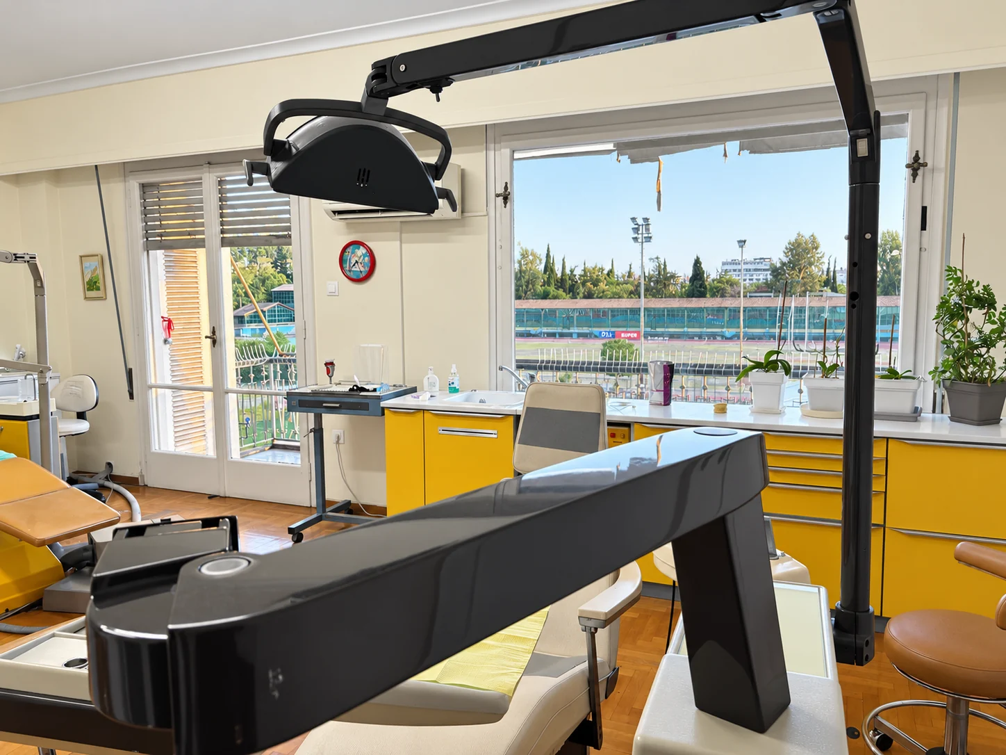 Dental equipment beside the large treatment-room windows